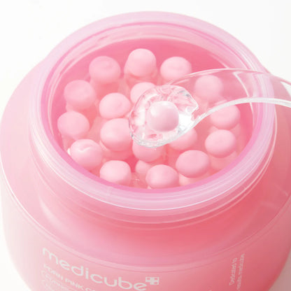 Geöffneter Tiegel der Medicube PDRN Pink Collagen Capsule Cream 55 g mit rosa Kapseln in transparentem Gel